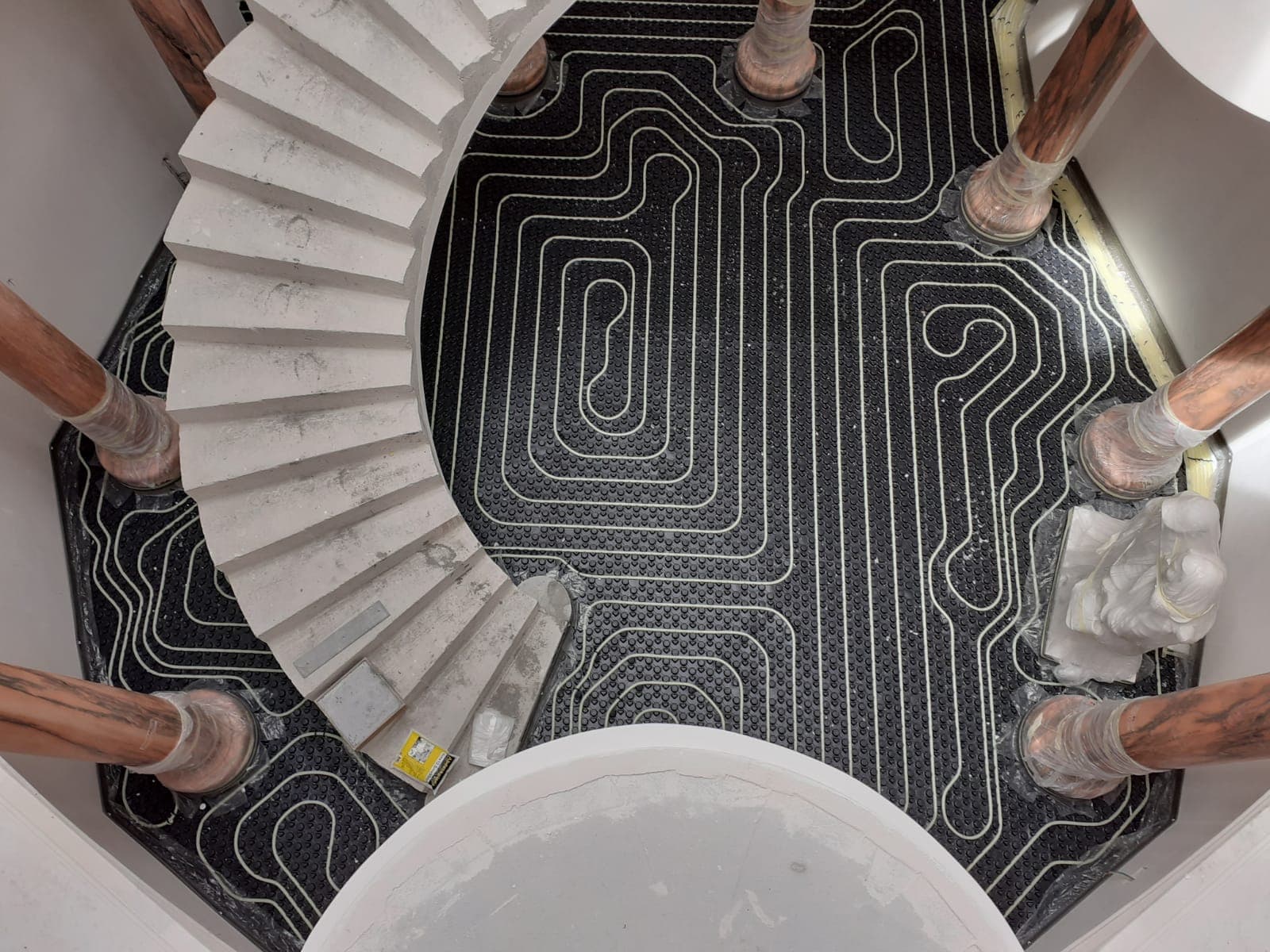 Underfloor heating pipework laid on insulation before the screed