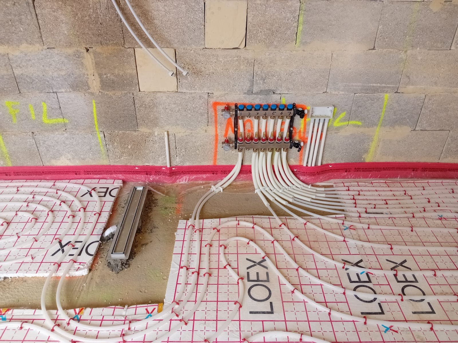Underfloor heating loops across a room