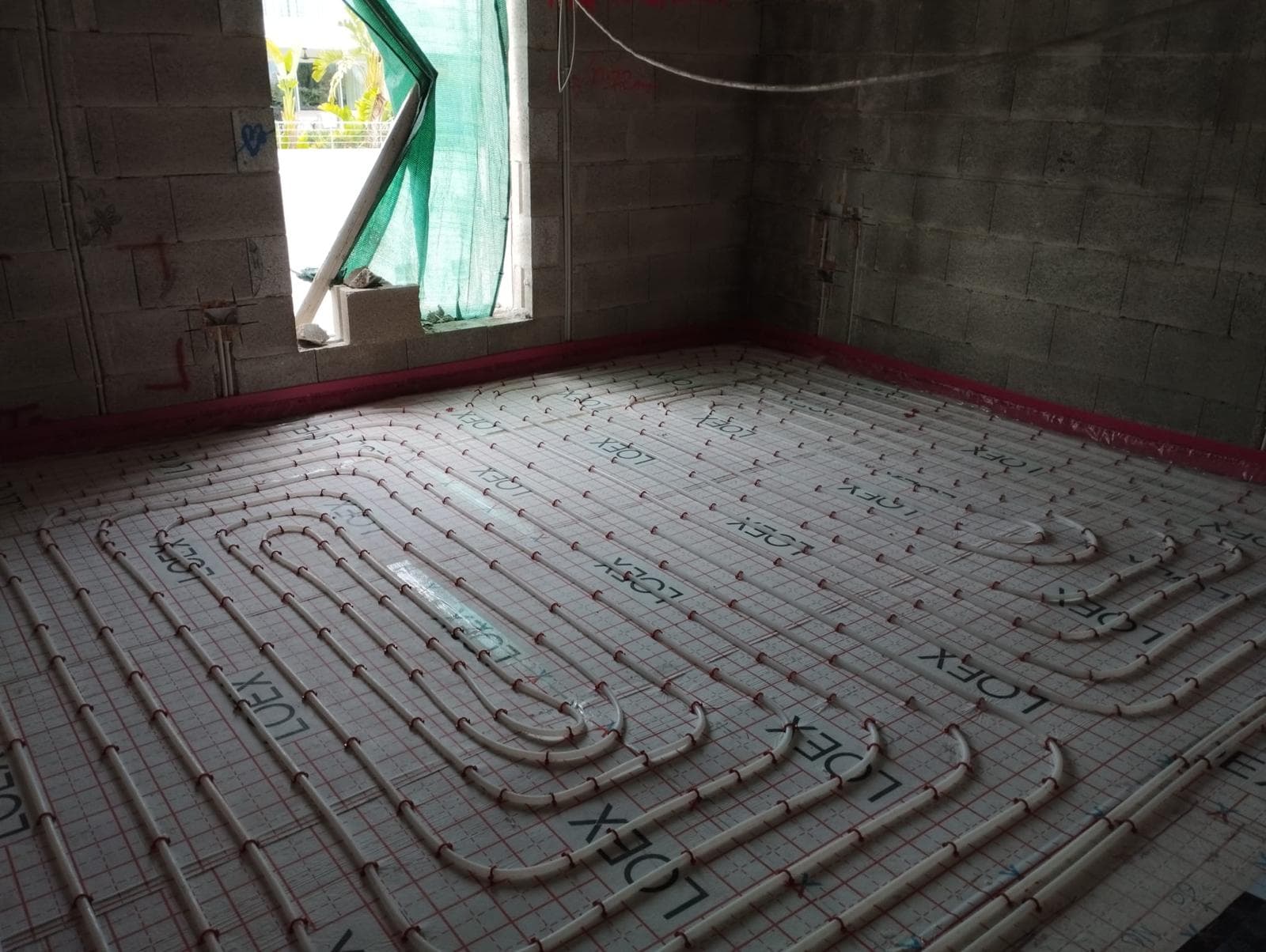 Underfloor heating installation in progress